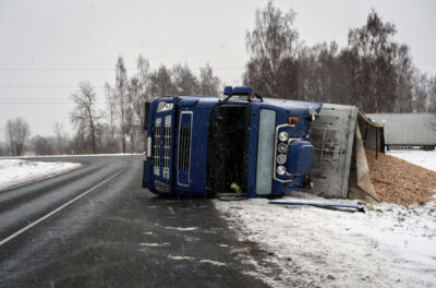 Blog - Truck Flipped Over By The Road While It Is Snowing